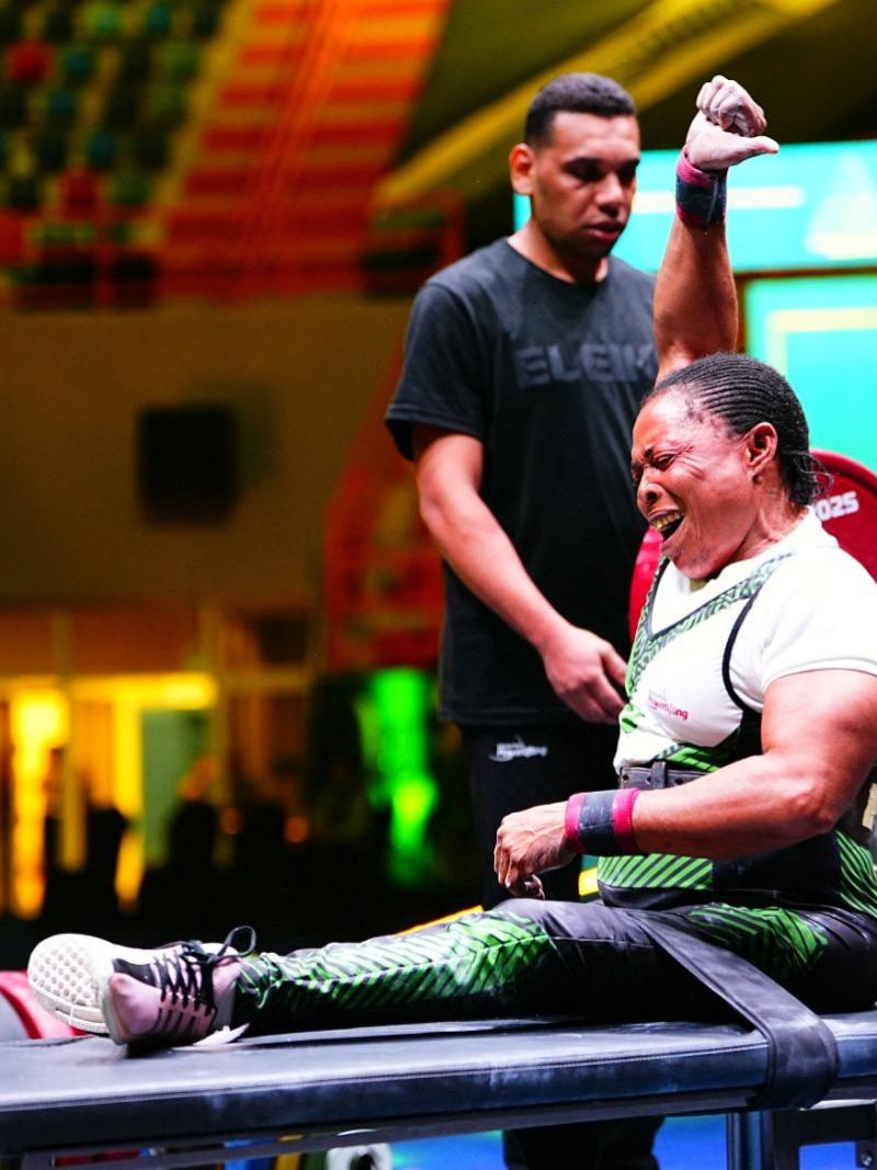 An athlete celebrates in joy